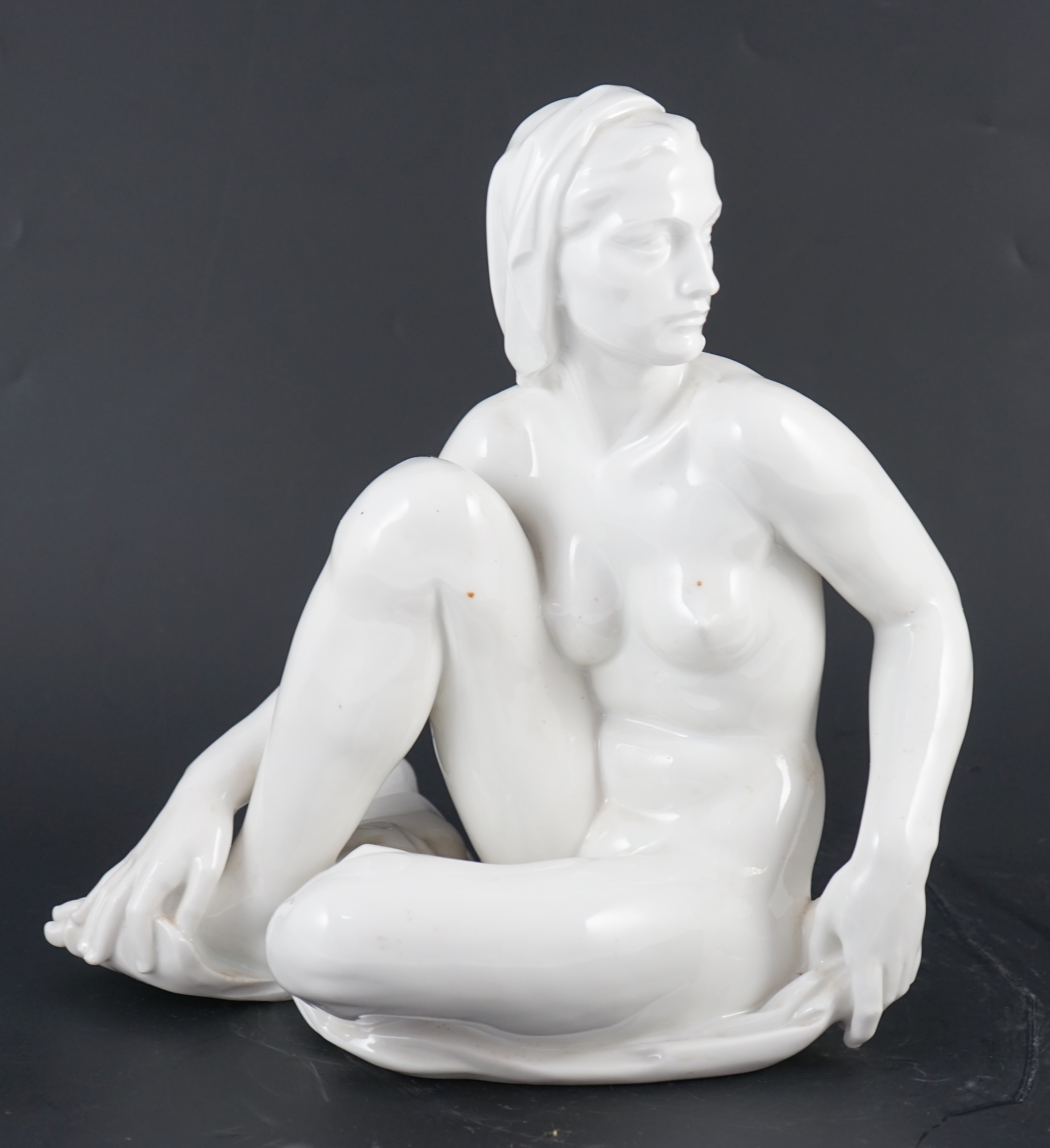 Robert Ullmann (1903-1966) for Meissen, a white glazed porcelain figure of a seated female nude, 31.5cm high